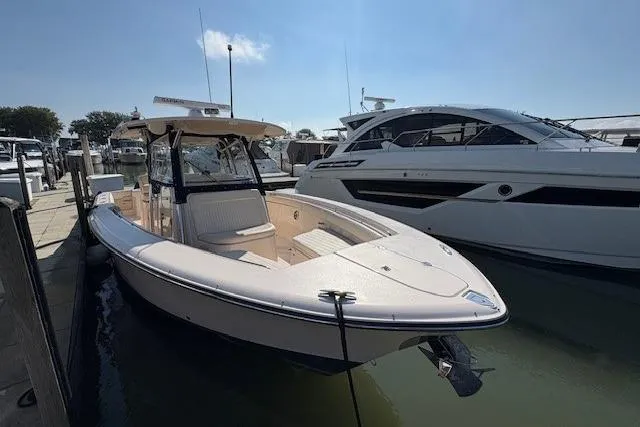 Yacht Photos Pics 2013 Grady-White Canyon 336 boat docked at marina, sunny day.