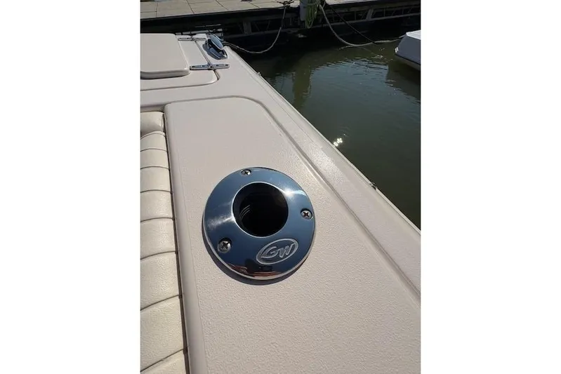  Yacht Photos Pics 2013 Grady-White Canyon 336 boat detail with chrome rod holder by the water.