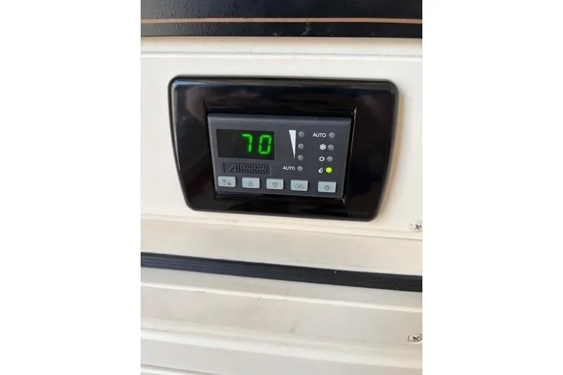  Yacht Photos Pics Digital control panel on 2013 Grady-White Canyon 336 boat, displaying temperature at 70 degrees.