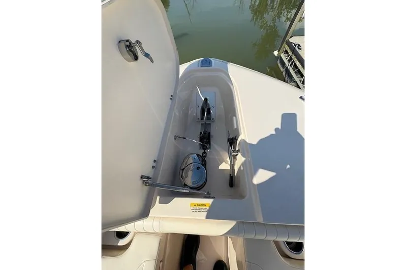  Yacht Photos Pics Open anchor compartment on 2013 Grady-White Canyon 336 boat, showing anchor mechanism.