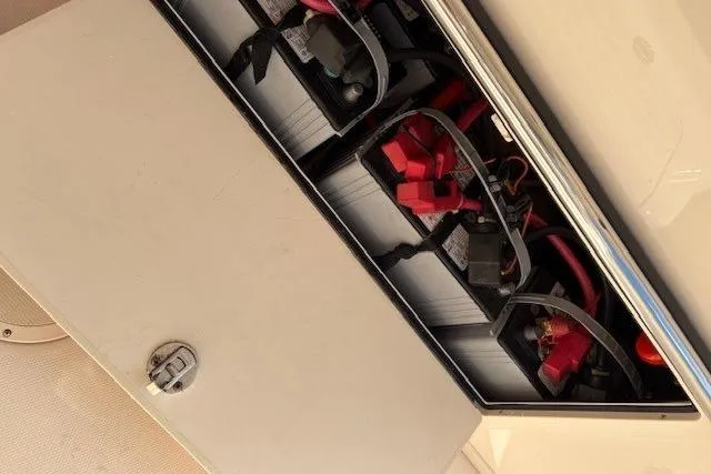  Yacht Photos Pics Battery compartment of a 2013 Grady-White Canyon 336 boat, showing wiring and connections.