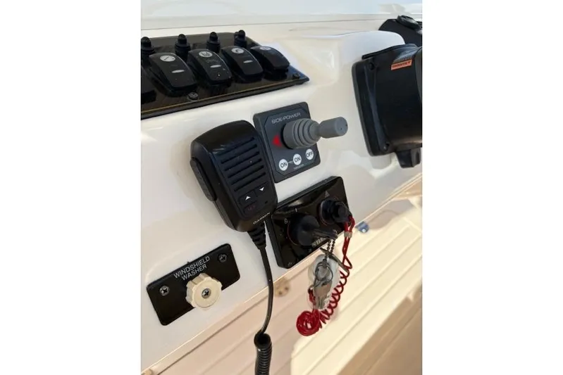  Yacht Photos Pics 2013 Grady-White Canyon 336 boat control panel with microphone and switches.