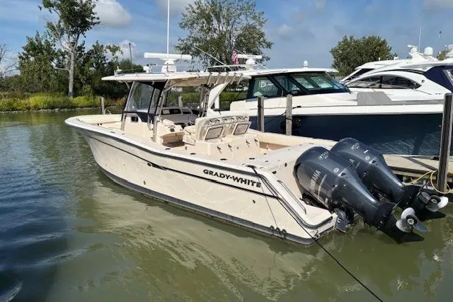  Yacht Photos Pics 2013 Grady-White Canyon 336 boat docked with twin outboard engines.