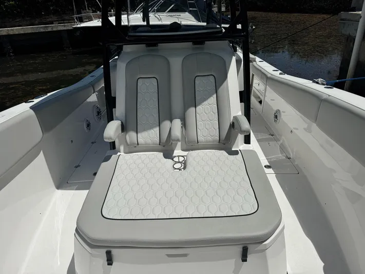  Yacht Photos Pics 2022 Sea Fox 328 Commander boat interior with cushioned seating and armrests.