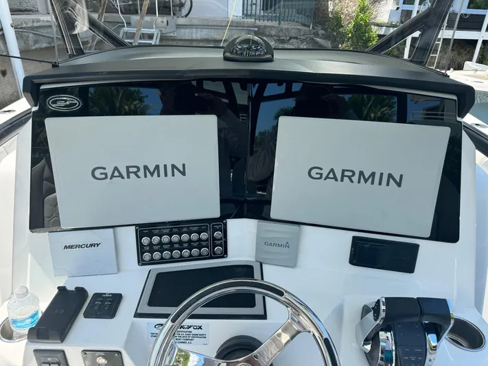  Yacht Photos Pics 2022 Sea Fox 328 Commander helm with dual Garmin displays and Mercury controls.