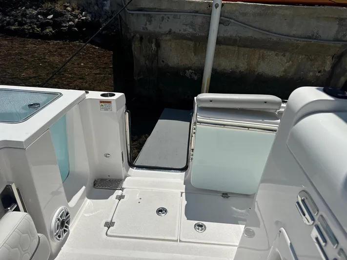  Yacht Photos Pics 2022 Sea Fox 328 Commander boat deck with seating and storage compartments.