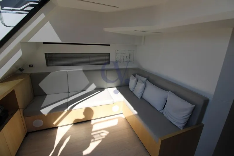 L Yacht Photos Pics Modern interior of 2023 MandaYachts Manda S05 with sleek seating and natural light.