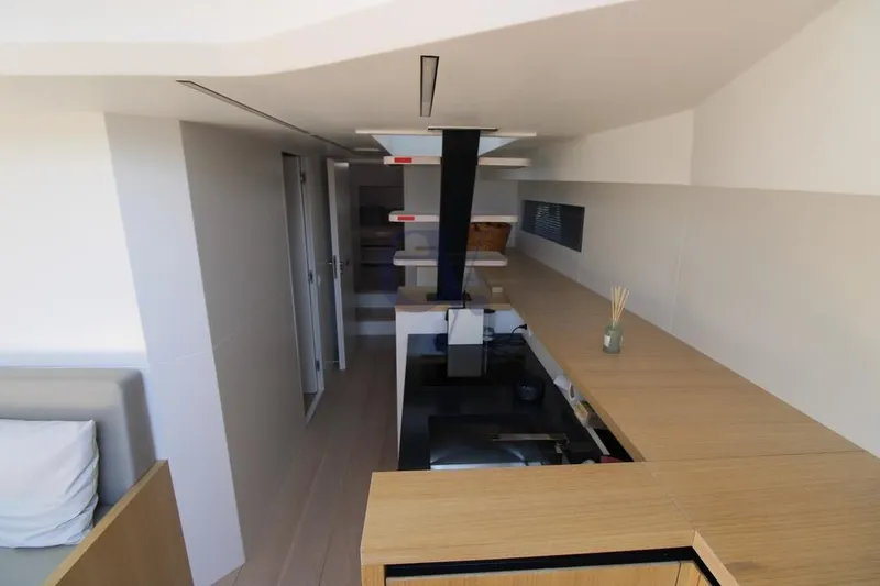 L Yacht Photos Pics Modern interior of 2023 MandaYachts Manda S05, featuring sleek design and wooden finishes.