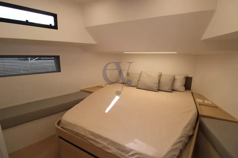 L Yacht Photos Pics Luxurious cabin interior of 2023 MandaYachts Manda S05 with cozy bed and modern design.