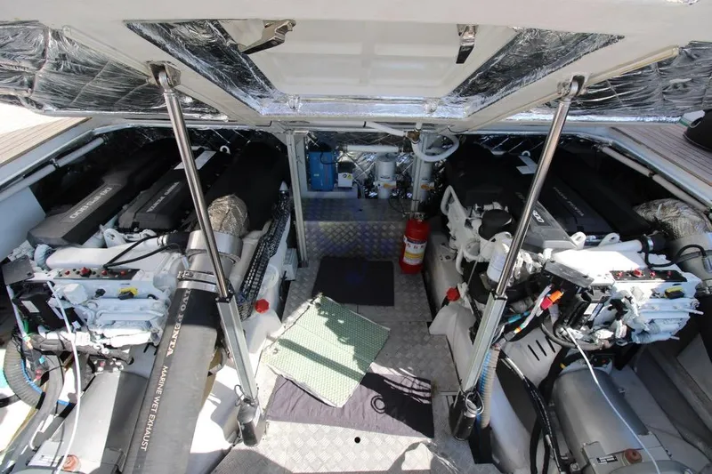 L Yacht Photos Pics Engine room of 2023 MandaYachts Manda S05, featuring dual engines and marine equipment.