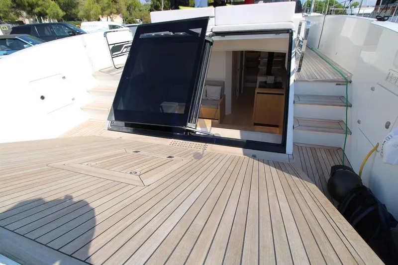 L Yacht Photos Pics Modern 2023 MandaYachts Manda S05 deck with open cabin entrance and sleek design.