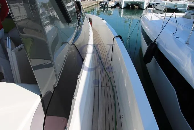 L Yacht Photos Pics 2023 MandaYachts Manda S05 yacht docked, showcasing sleek design and modern features.