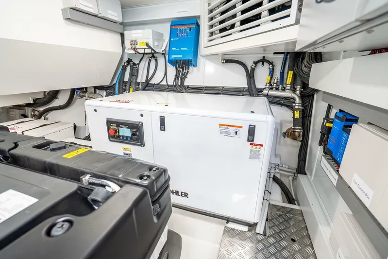  Yacht Photos Pics Engine room of 2025 Pearl 63 yacht with Kohler generator and electrical systems.