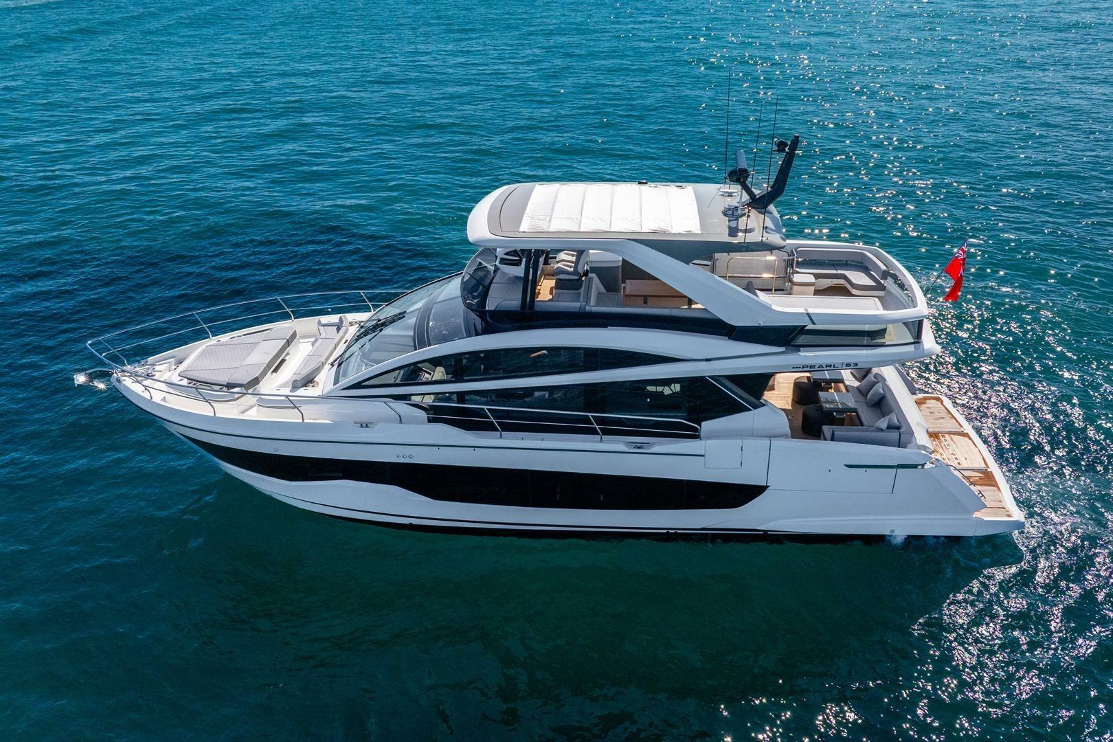 2025 Pearl 63 yacht cruising on clear blue ocean waters.
