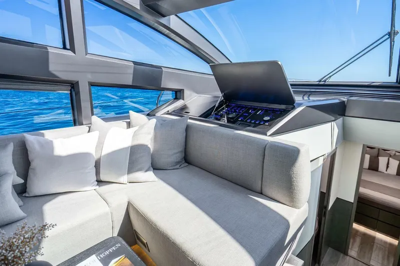  Yacht Photos Pics Luxurious interior of 2025 Pearl 63 yacht with modern seating and ocean view.