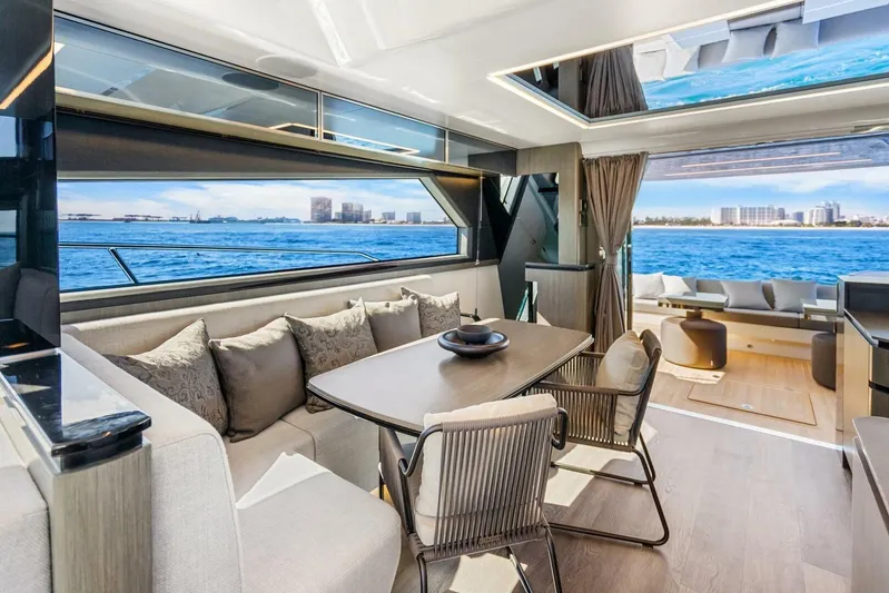  Yacht Photos Pics Luxurious interior of 2025 Pearl 63 yacht with ocean view and elegant seating area.