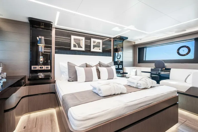  Yacht Photos Pics Luxurious bedroom interior of 2025 Pearl 63 yacht with modern decor and elegant furnishings.