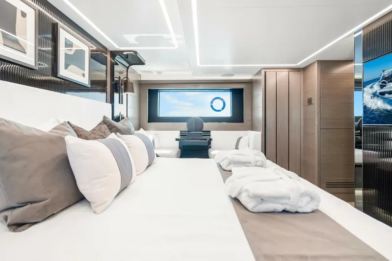  Yacht Photos Pics Luxurious interior of 2025 Pearl 63 yacht with elegant bedding and modern decor.