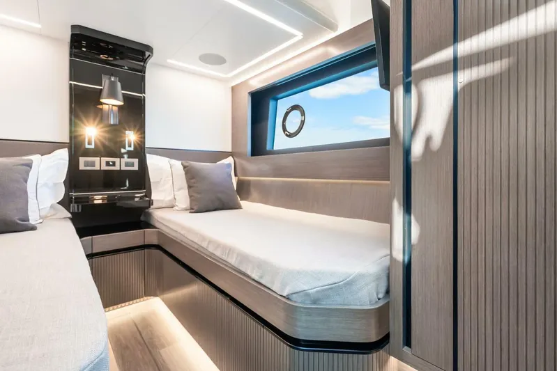  Yacht Photos Pics Luxurious cabin interior of 2025 Pearl 63 yacht with modern design and ambient lighting.