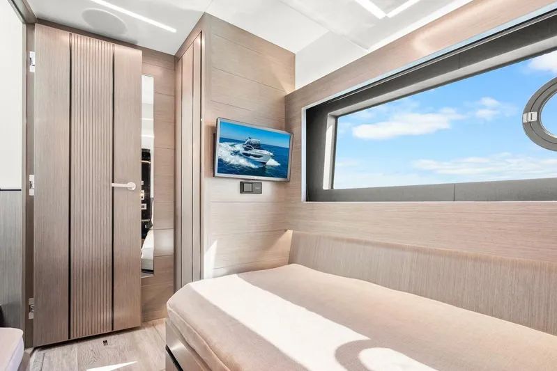  Yacht Photos Pics Luxurious interior of 2025 Pearl 63 yacht with modern design and large window view.