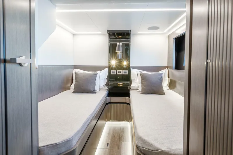  Yacht Photos Pics Luxurious interior of 2025 Pearl 63 yacht with twin beds and modern lighting.
