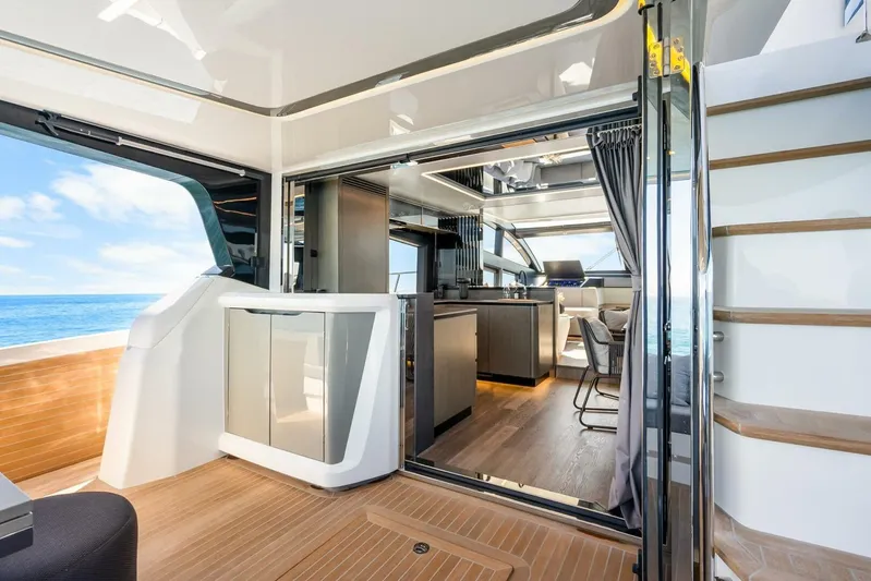  Yacht Photos Pics Luxurious interior of 2025 Pearl 63 yacht with modern kitchen and ocean view.