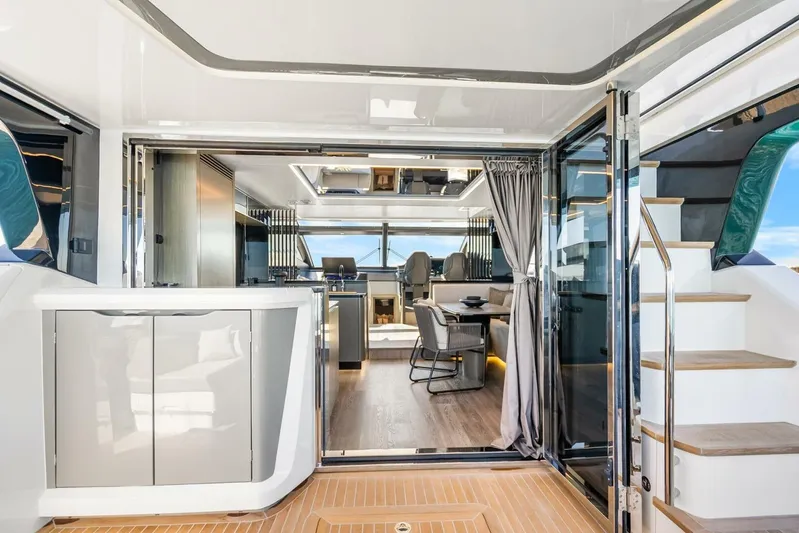  Yacht Photos Pics Luxurious interior of 2025 Pearl 63 yacht with modern design and elegant furnishings.
