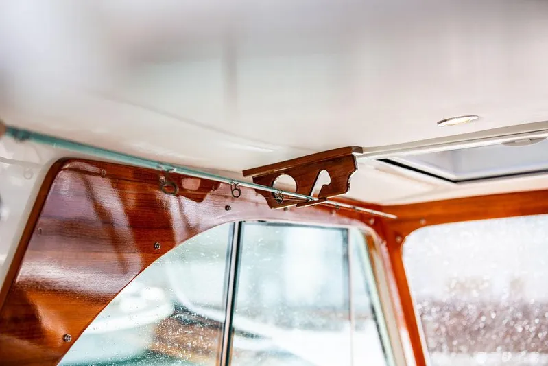 Golightly Yacht Photos Pics Interior detail of 2023 Hinckley Picnic Boat 34 S, showcasing elegant wood finish and window design.