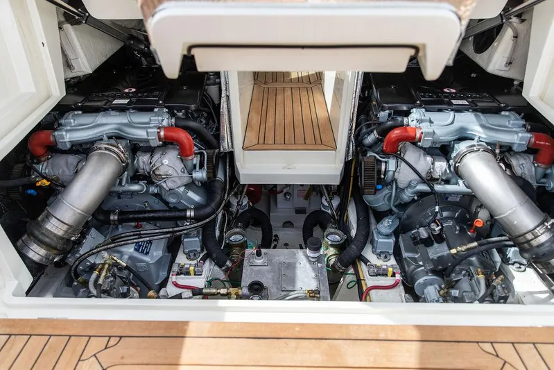 Golightly Yacht Photos Pics Engine compartment of 2023 Hinckley Picnic Boat 34 S, showcasing dual engines and mechanical components.