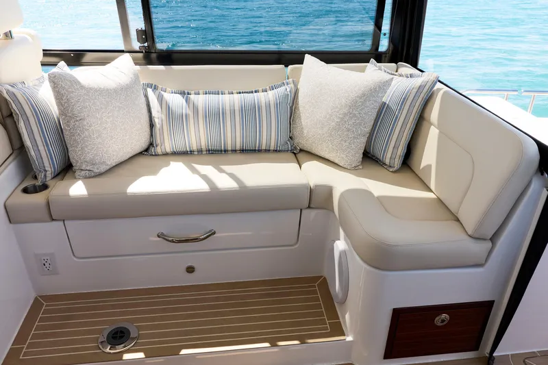 In Stock Yacht Photos Pics Luxurious seating area on 2026 MJM 47X yacht with plush cushions and ocean view.
