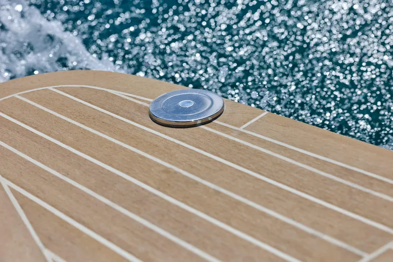 In Stock Yacht Photos Pics Teak deck of 2026 MJM 47X yacht with ocean backdrop.