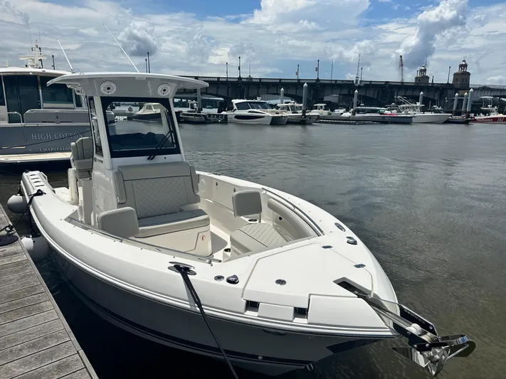 Praiano Yacht Photos Pics 2019 Tiara Sport 38 LS boat docked at marina under cloudy sky.