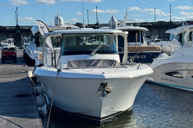 Praiano Yacht Photos Pics 2019 Tiara Sport 38 LS yacht docked at marina under clear blue sky.