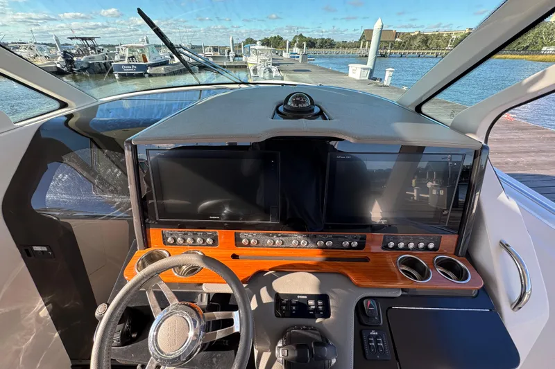 Praiano Yacht Photos Pics 2019 Tiara Sport 38 LS helm with dual screens and wooden dashboard at marina.