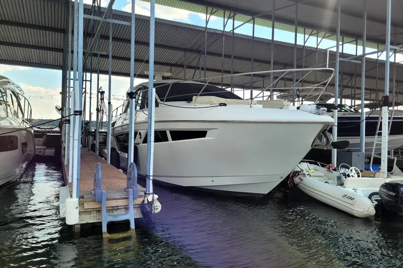Imagine Yacht Photos Pics 2021 Cruisers Yachts 50 Cantius docked in a covered marina.