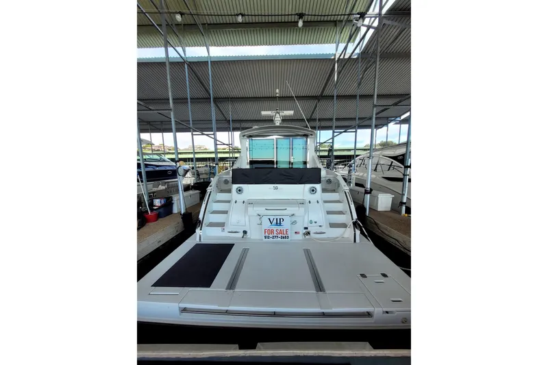 Imagine Yacht Photos Pics 2021 Cruisers Yachts 50 Cantius for sale, docked in a covered marina.