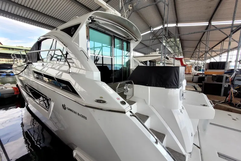 Imagine Yacht Photos Pics 2021 Cruisers Yachts 50 Cantius docked in a covered marina.