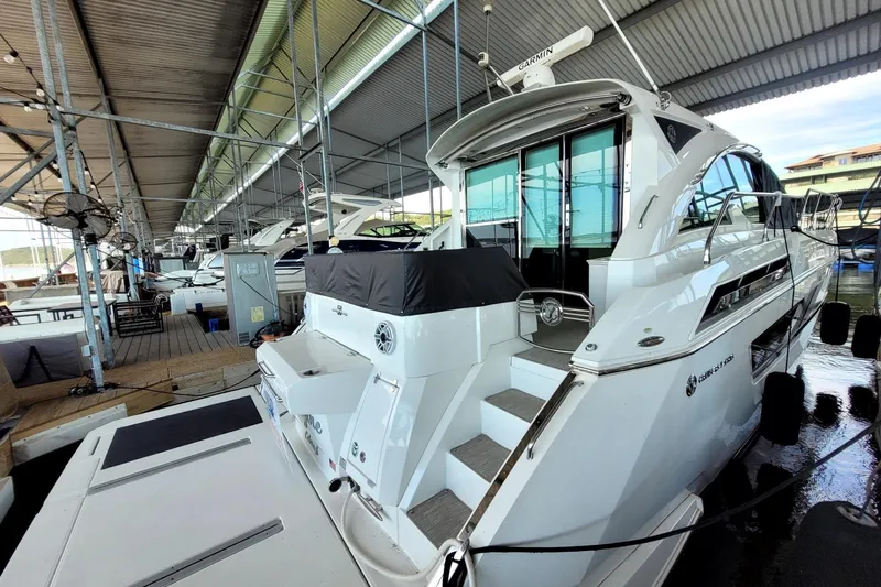 Imagine Yacht Photos Pics 2021 Cruisers Yachts 50 Cantius docked in a covered marina.