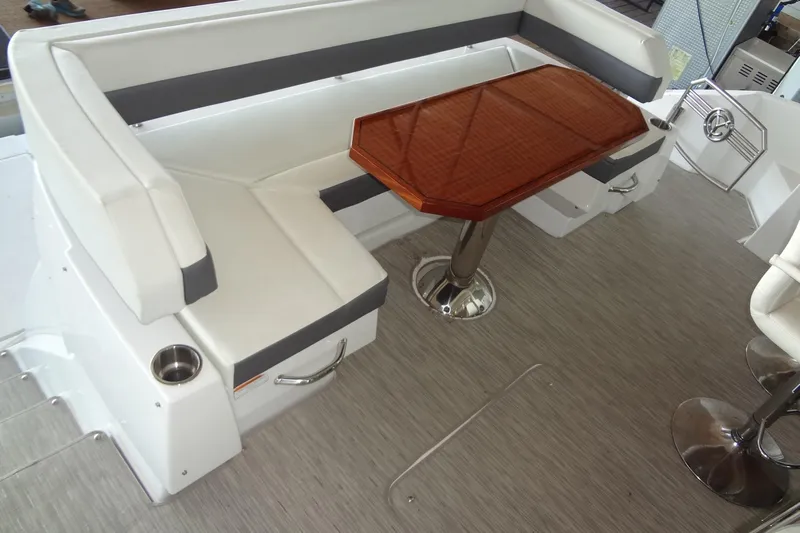 Imagine Yacht Photos Pics 2021 Cruisers Yachts 50 Cantius interior with white seating and wooden table.