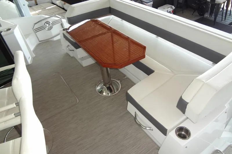Imagine Yacht Photos Pics 2021 Cruisers Yachts 50 Cantius interior with elegant seating and wooden table.