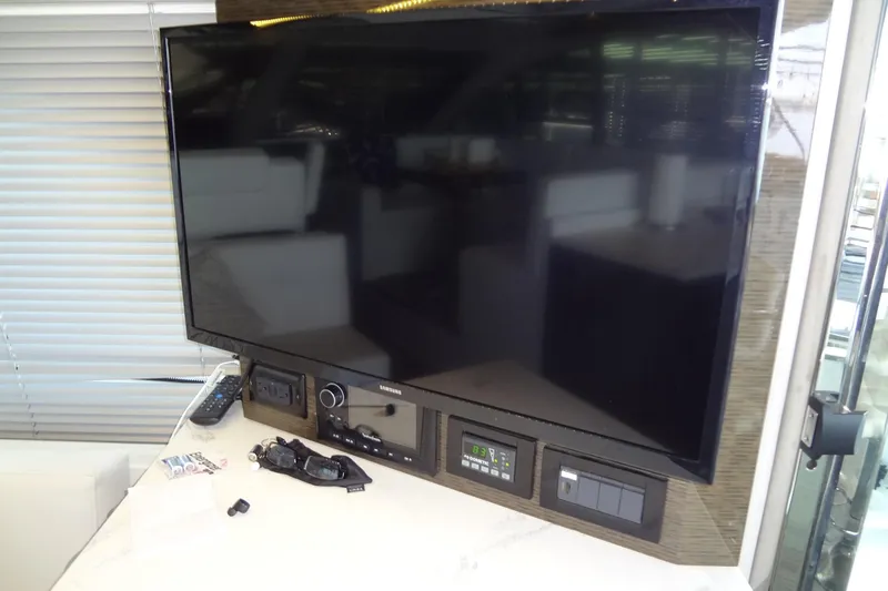 Imagine Yacht Photos Pics Samsung TV and control panel inside 2021 Cruisers Yachts 50 Cantius.