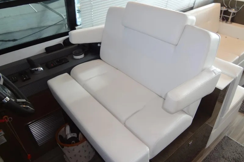 Imagine Yacht Photos Pics Luxurious white seating in 2021 Cruisers Yachts 50 Cantius cockpit area.