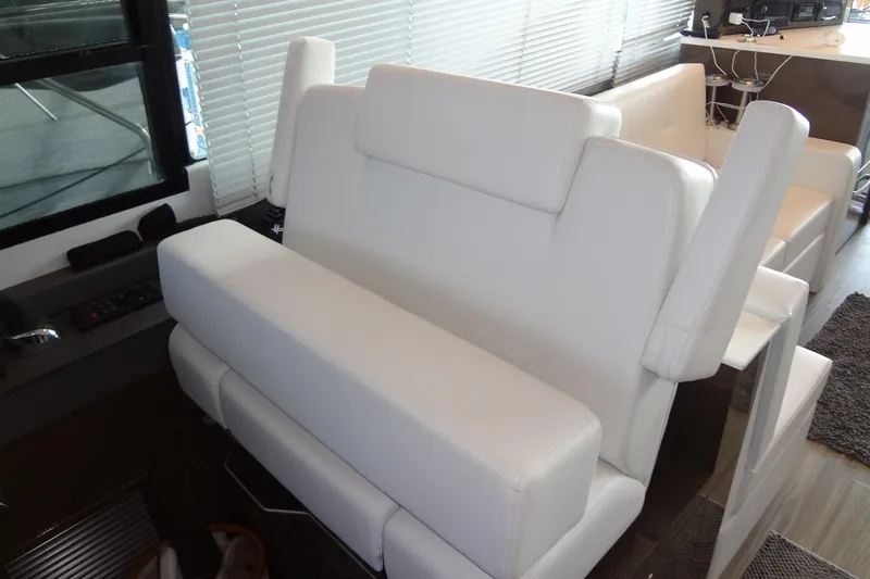 Imagine Yacht Photos Pics Luxurious white seating in 2021 Cruisers Yachts 50 Cantius interior.