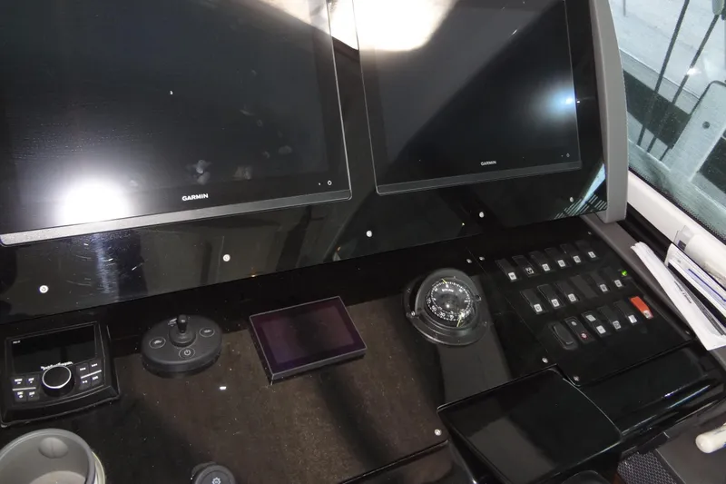 Imagine Yacht Photos Pics Control panel of 2021 Cruisers Yachts 50 Cantius with Garmin displays and navigation instruments.