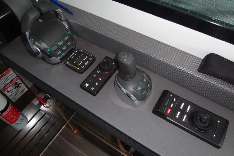 Imagine Yacht Photos Pics Control panel of 2021 Cruisers Yachts 50 Cantius with joystick and throttle controls.