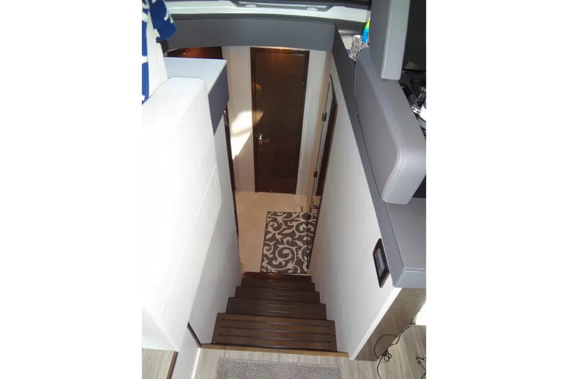 Imagine Yacht Photos Pics Interior staircase of 2021 Cruisers Yachts 50 Cantius, featuring modern design and elegant decor.