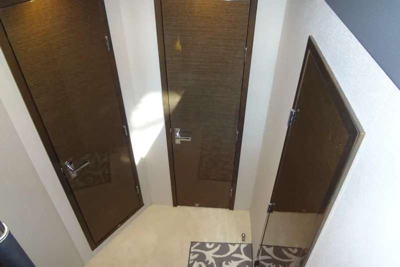 Imagine Yacht Photos Pics Interior view of 2021 Cruisers Yachts 50 Cantius with three wooden doors.