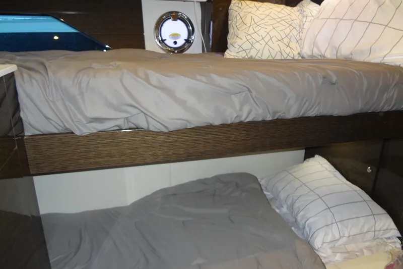 Imagine Yacht Photos Pics Bunk beds in 2021 Cruisers Yachts 50 Cantius cabin with modern bedding.