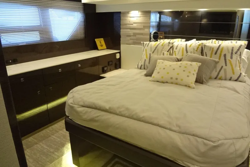 Imagine Yacht Photos Pics Luxurious bedroom interior of 2021 Cruisers Yachts 50 Cantius with modern decor and plush bedding.