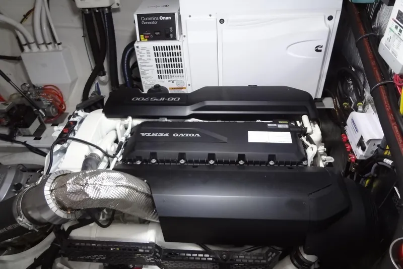 Imagine Yacht Photos Pics Engine room of 2021 Cruisers Yachts 50 Cantius with Volvo Penta and Cummins Onan generator.
